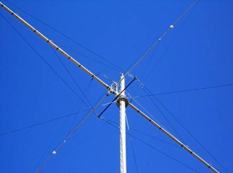 Top antenna at 165' bottom at 80'. 3 el Optibeam 80M yagis highly modified by K7NV. 44 truss lines on boom and elements of each antenna. 600 lbs each.